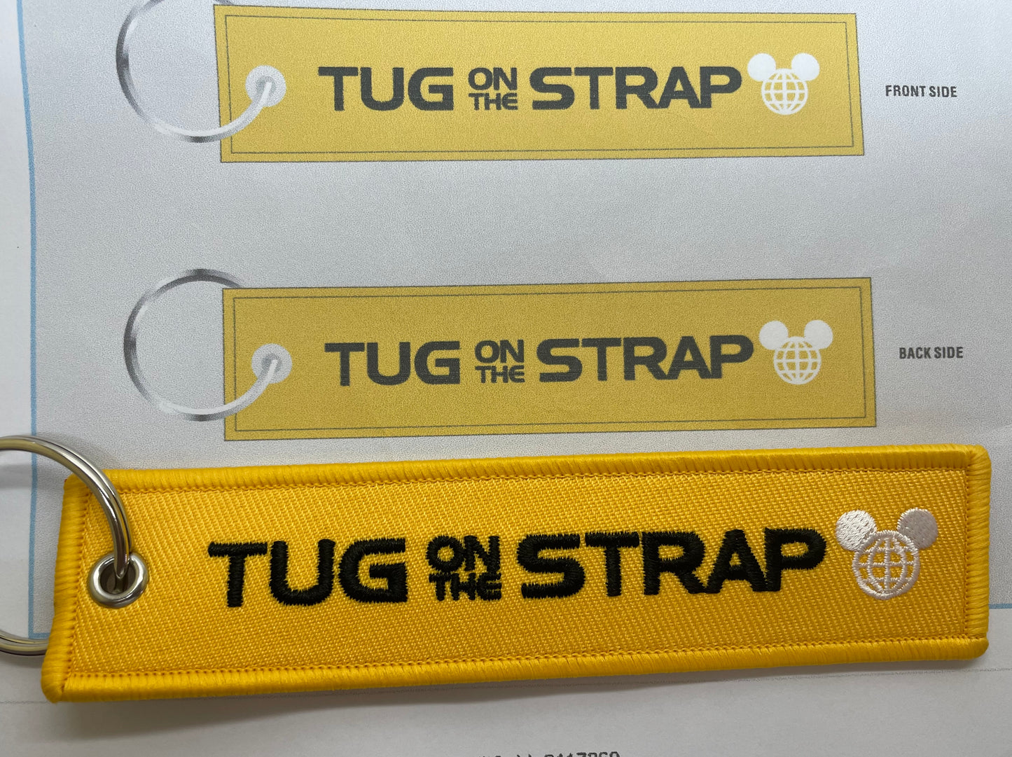 Tug on the Strap Keychain