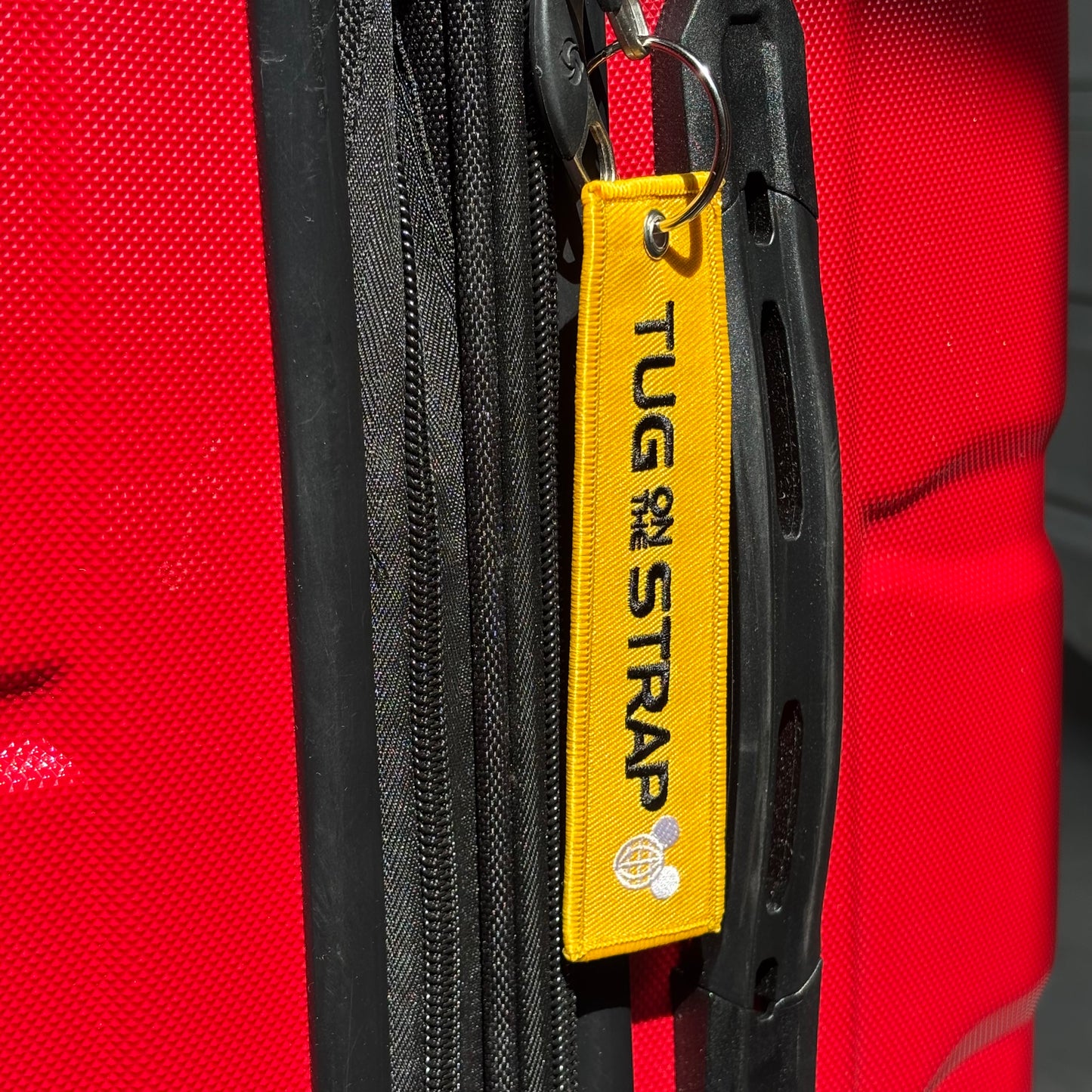 Tug on the Strap Keychain