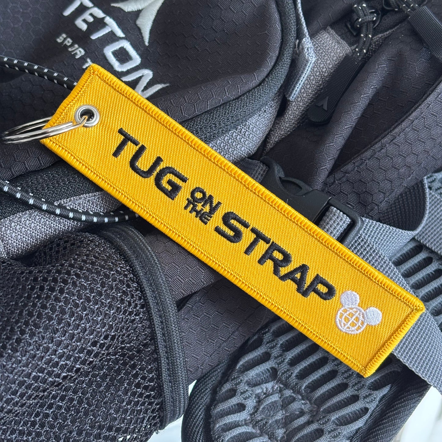 Tug on the Strap Keychain